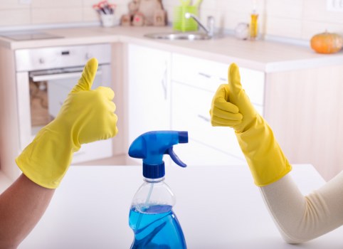 Carpet cleaning professional preparing equipment safely in an SW2 property