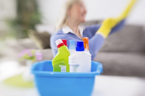 Domestic cleaner tidying a kitchen in SW2
